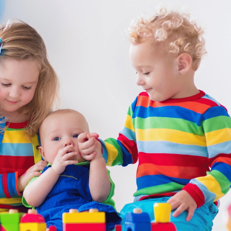 Children playing with wooden blocks, from the BabyCoo store
