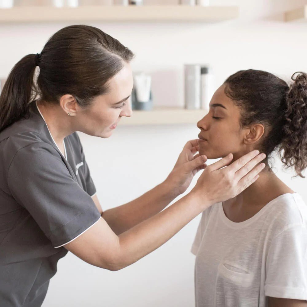 A Dermalogica skin therapist treating a client